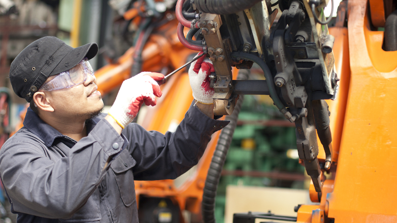 Worker fixing an engine